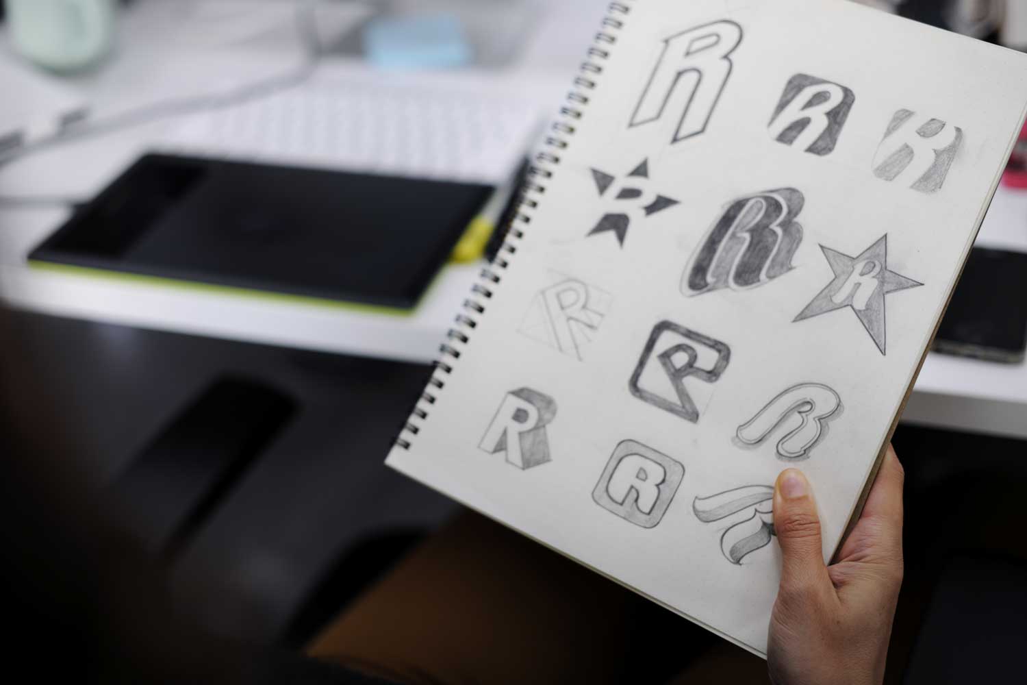 person working on a logo